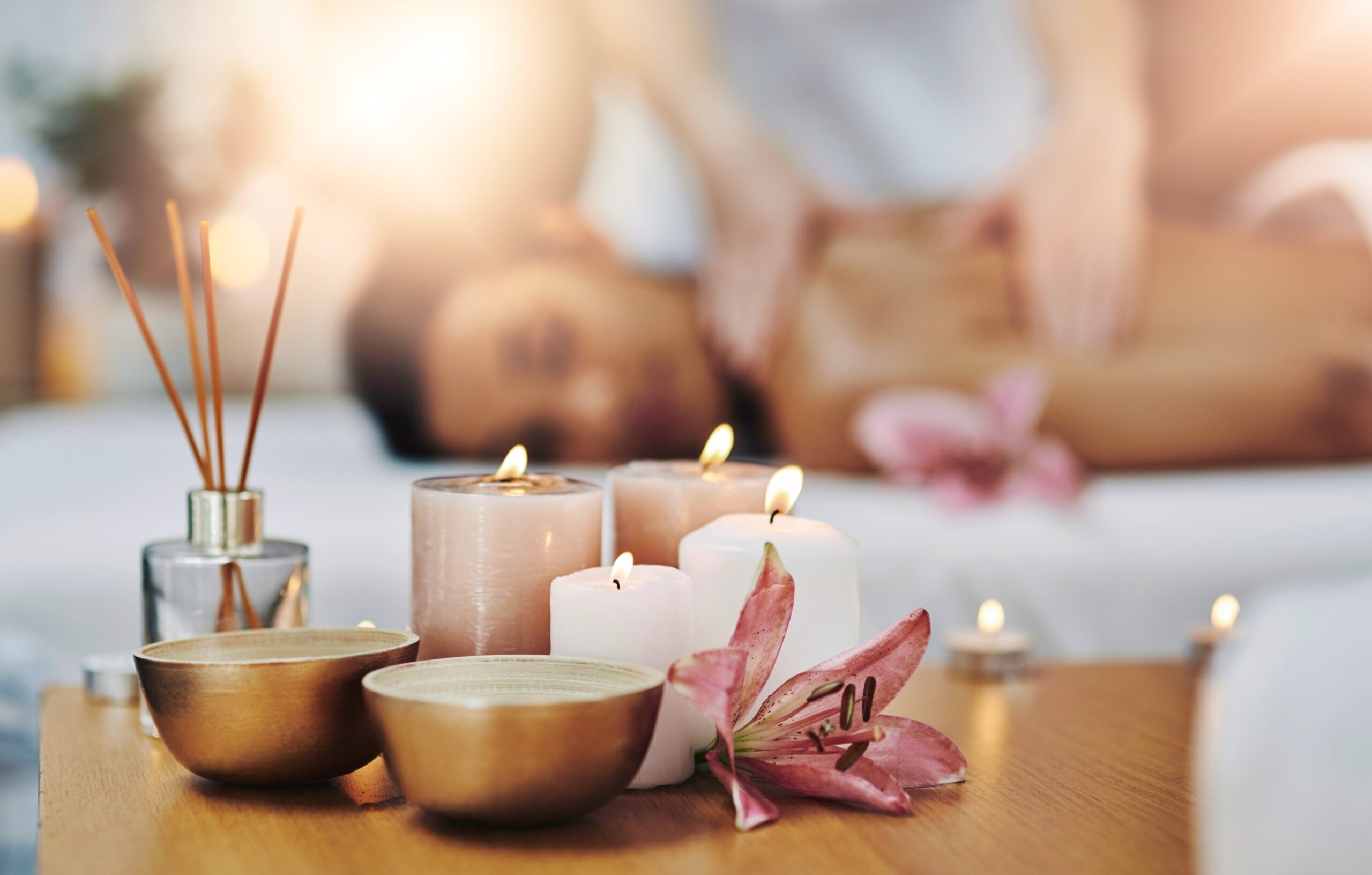 Aromatherapy, candles and massage with people in spa to relax for health, treatment or wellness. Incense, plant and scent with customer at luxury resort for holistic stress relief or natural healing.