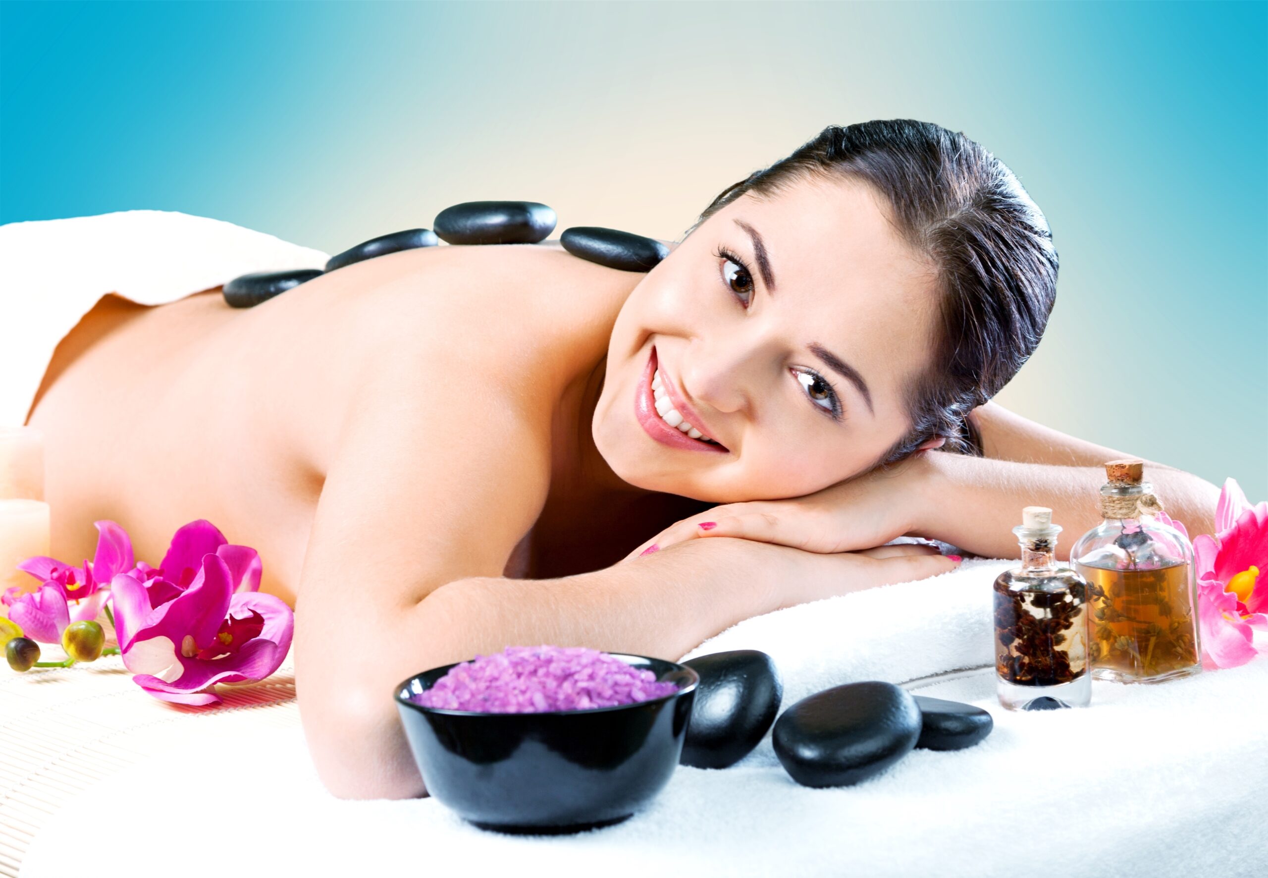Woman natural beauty. Beautiful smiling girl outdoor portrait at massage spa.