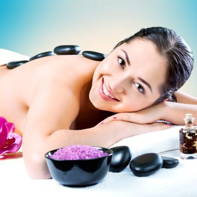 Woman natural beauty. Beautiful smiling girl outdoor portrait at massage spa.